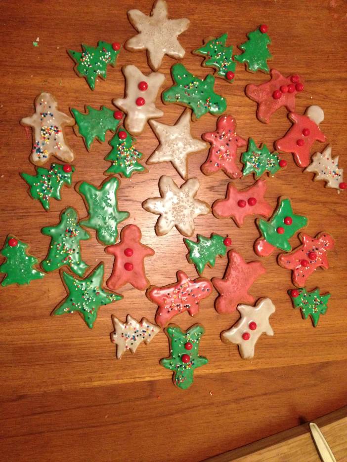 This year's gingerbread cookies. I confess to being a control freak and frosting them all myself.
